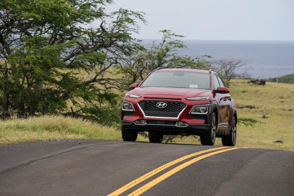 Hyundai Kona driving up a road